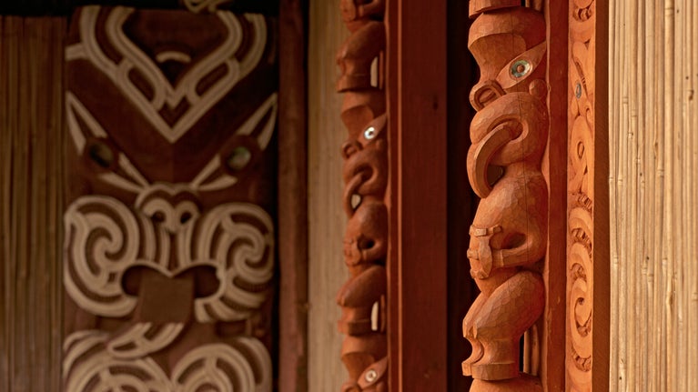 Māori carvings around a doorway